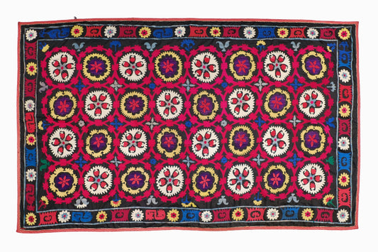 A multicoloured Suzani on a black background