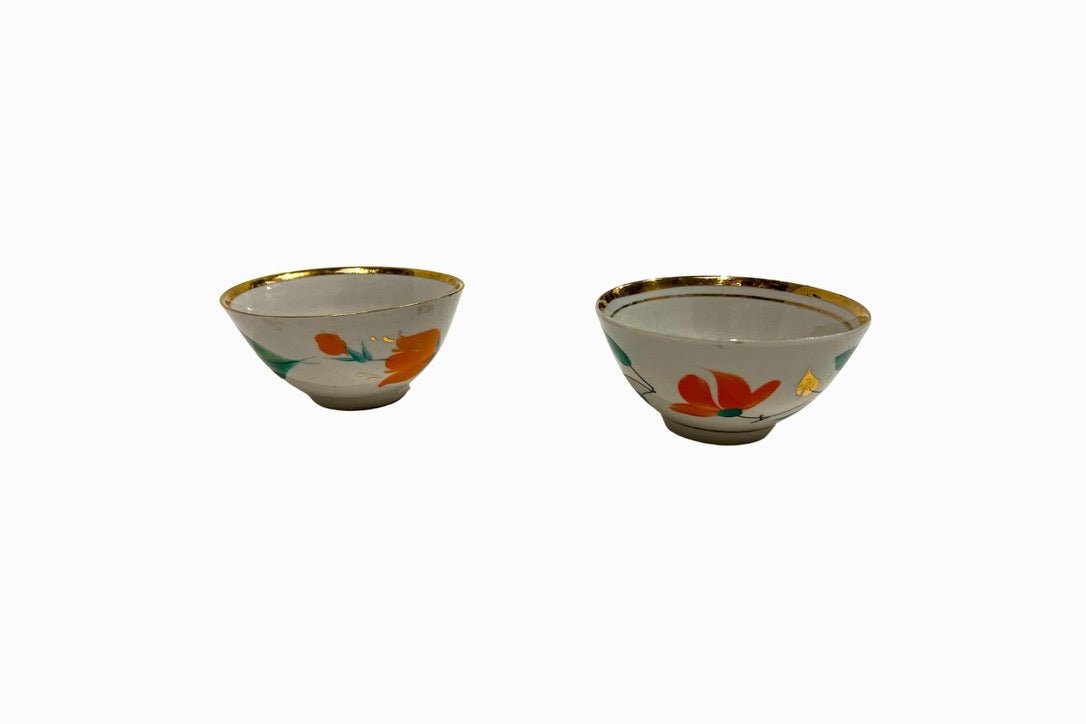 A pair of hand painted gold rimmed Uzbeki bowls