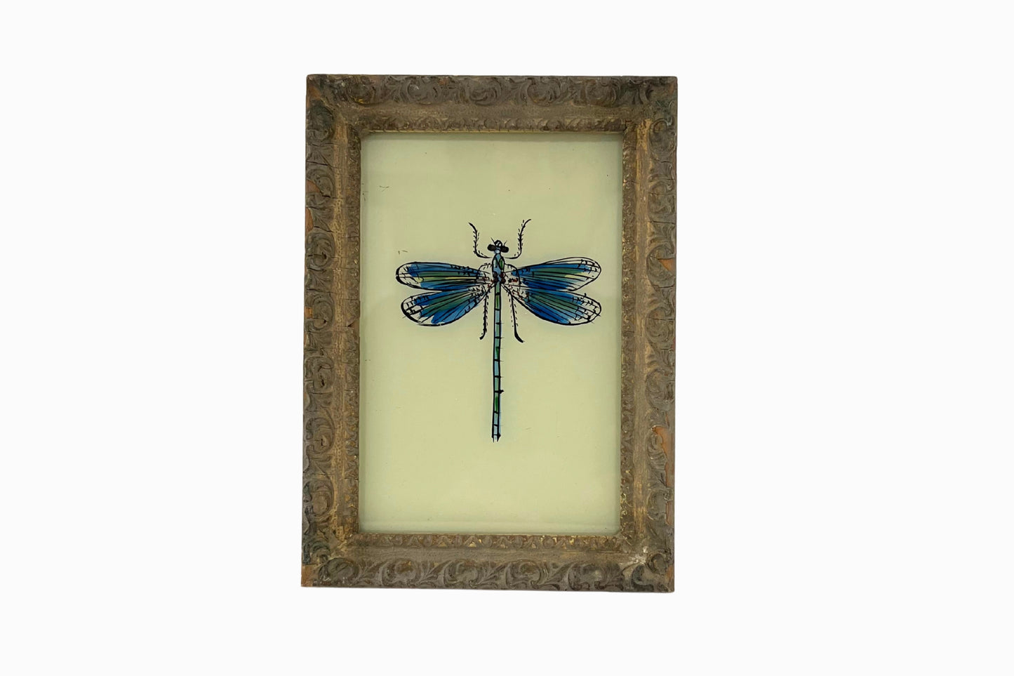 A reverse glass painting of a dragonfly