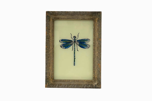 A reverse glass painting of a dragonfly