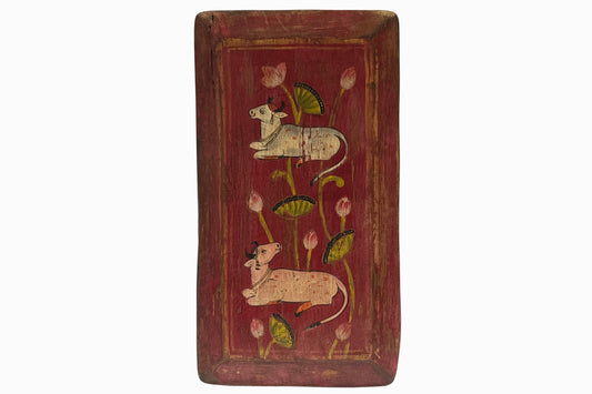 Two holy cows painted on red