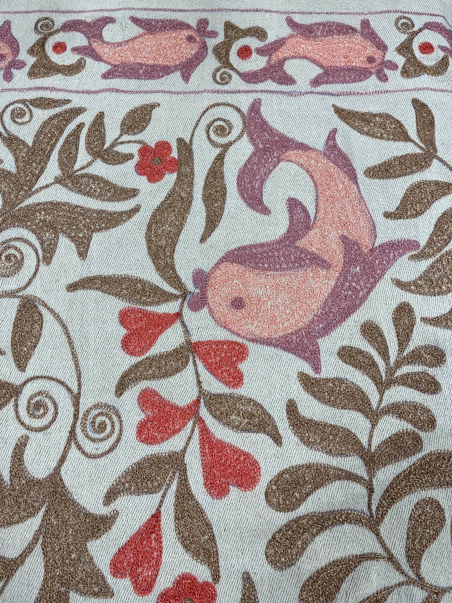 Bedspread with dolphin motif.