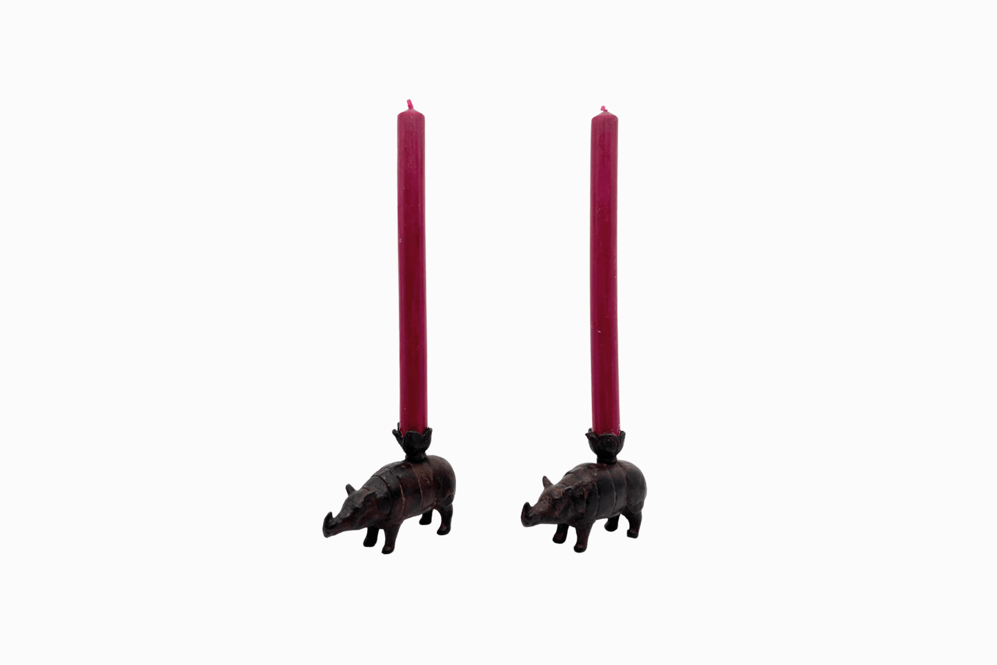 A pair of metal rhino candlesticks