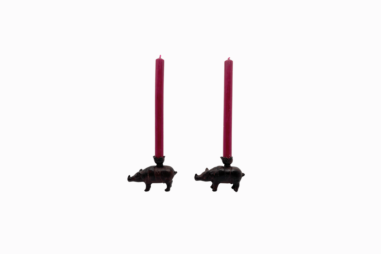 A pair of metal rhino candlesticks