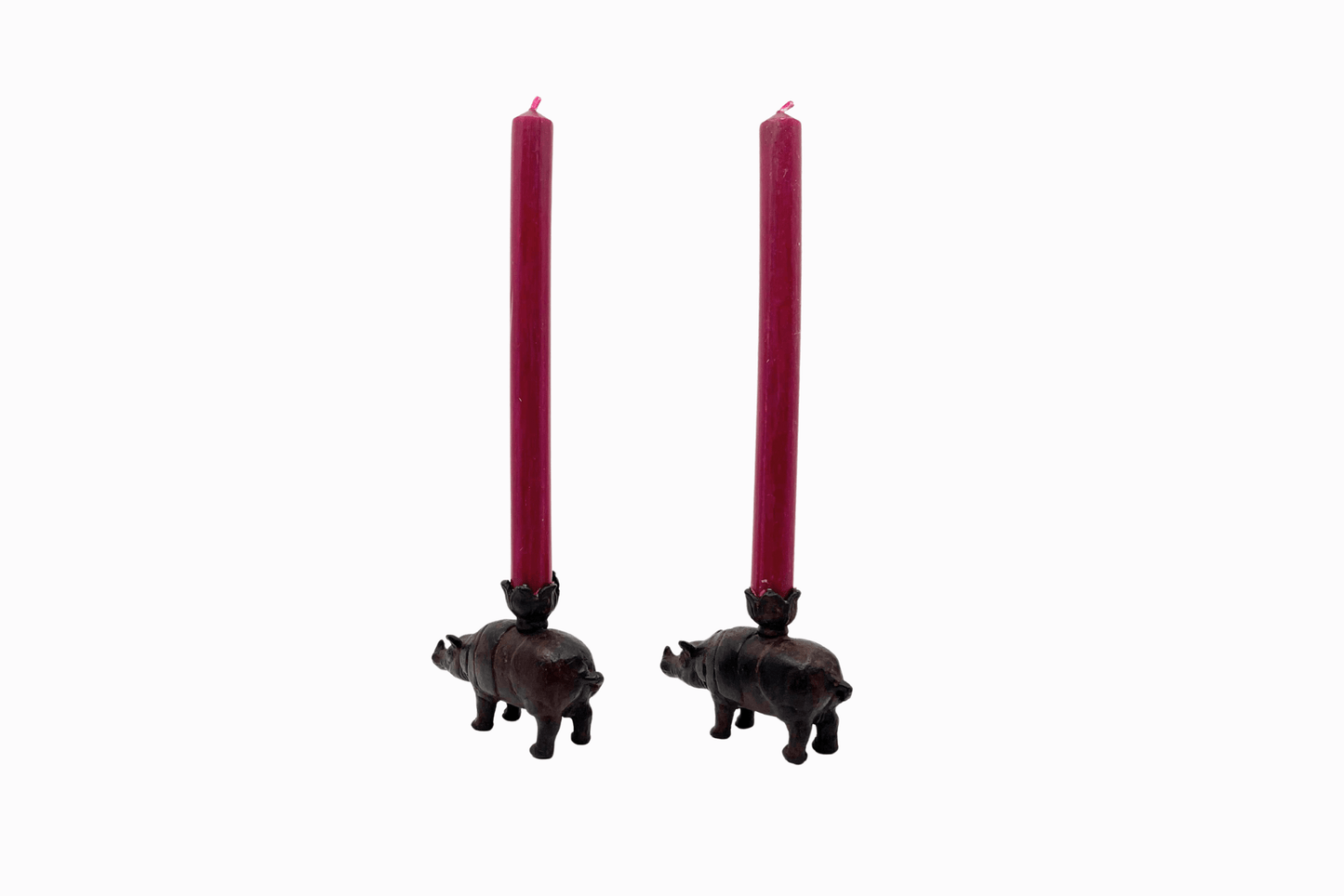 A pair of metal rhino candlesticks