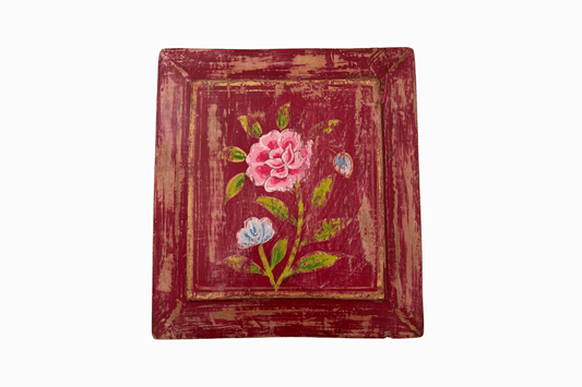 Roses on a red panel