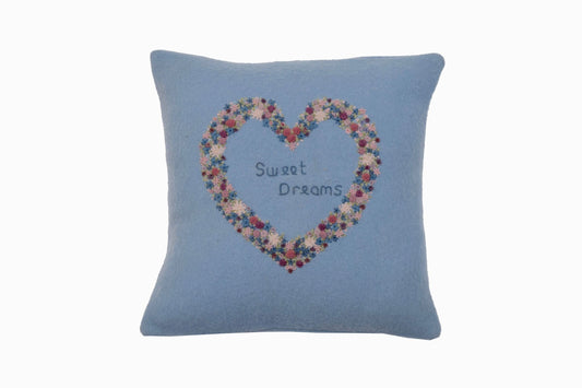 Blue wool cushion with embroidered heart
