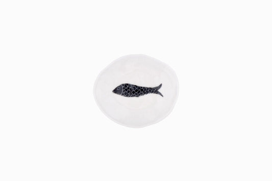 Tiny porcelain dish with black fish
