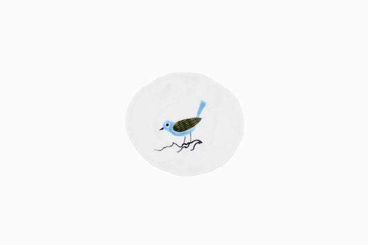 Tiny porcelain dish with dark green and blue bird