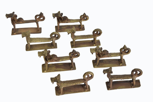 Set of eight West African knife rests
